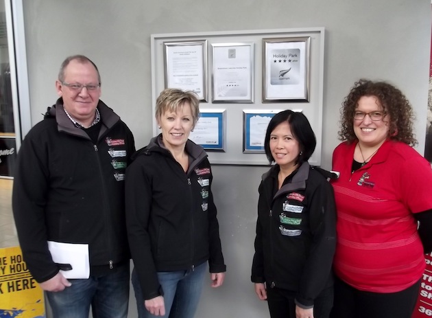 Peter and Cathy Coppens with members of the Queenstown Lakeview Holiday Park team.