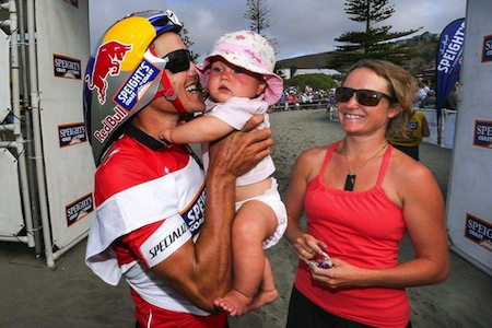  Wanaka-based Red Bull endurance athlete Braden Currie enjoys a cuddle with his daughter Bella (1), while proud wife Sally looks on, at the finish line of the 2014 Speights Coast to Coast.  Credit: Paul's Camera Shop.