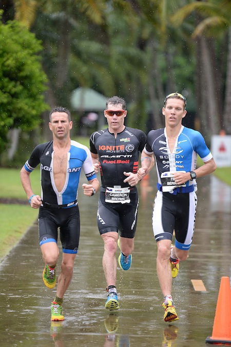 Cameron Brown (centre) on his way to beating former world champion Peter Robertson (left) and IRONMAN Western Australia champion Tim Berkel on the way to his record victory in Cairns last year. Credit: Delly Carr
