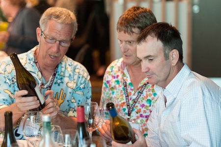 Dr Jeff Bragman and other guests study Central Otago Pinot Noir.