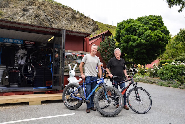 (L-R) Around the Mountains and Outside Sports owner John Knight holding a new electric bike with Gibbston Valley Winery CEO Greg Hunt holding a new 'fat bike'.
