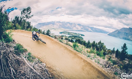 Queenstown rider Tim Ceci takes on one of the most scenic MTB corners in the world ­on Queenstown Bike Park¹s Thundergoat trail. Credit: Callum Wood