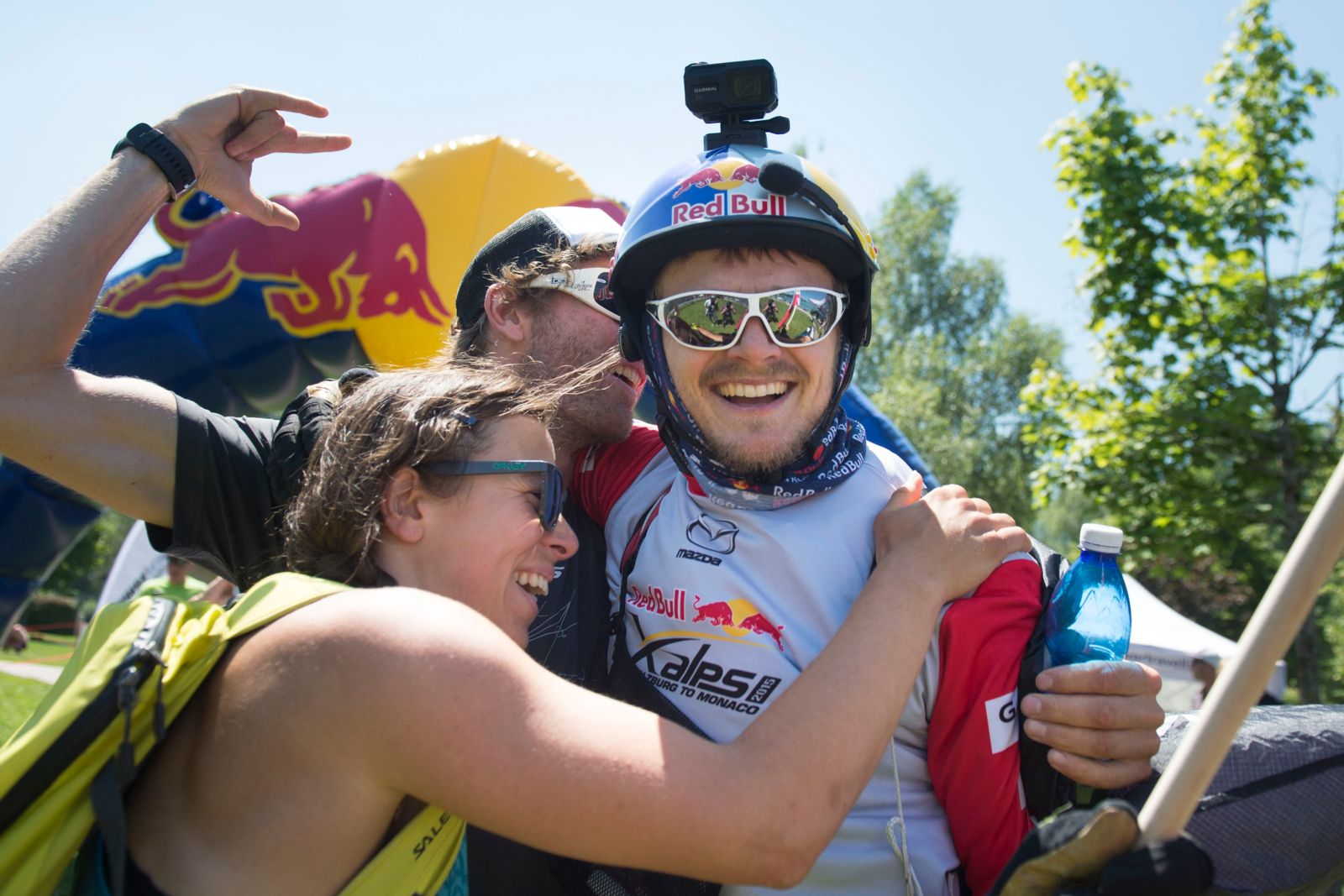 Smiles all around as Paul Guschlbauer (AUT1) is embraced by fans after landing in Fuschl am See. Guschlbauer snuck past Aaron Durogati (ITA) close to the finish to win the race.